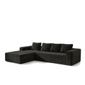 Canapé d'angle modulable en velours côtelé noir avec méridienne, sur fond blanc