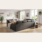 Dos du canapé en U gris anthracite dans un salon ouvert